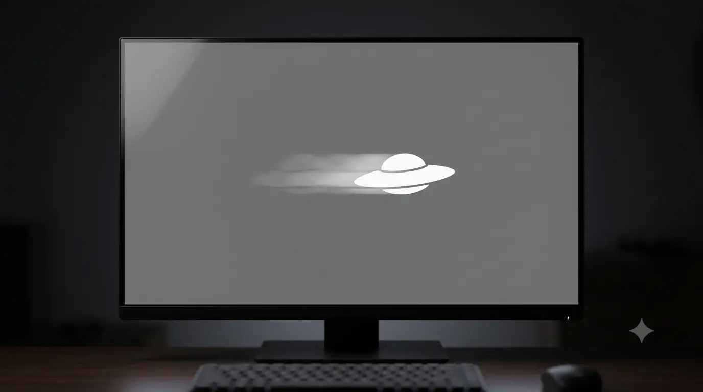 Close-up of a monitor showing a moving white UFO shape against a grey background with a faded smeared trail behind it, illustrating pixel ghosting